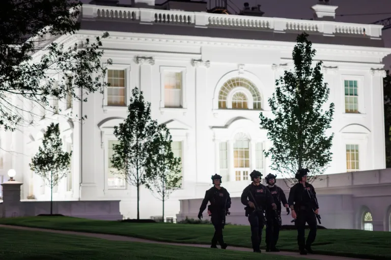 U.S. Secret Service agents patrol the North Lawn at the White House