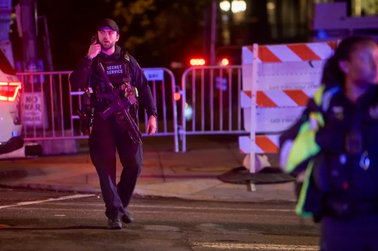 Members of the U.S. Secret Service and local police work to contain the scene outside the White House Correspondents' Dinner, during a shooting inside the Washington Hilton, Saturday, April 25, 2026, in Washington. (AP Photo/Rod Lamkey, Jr.)