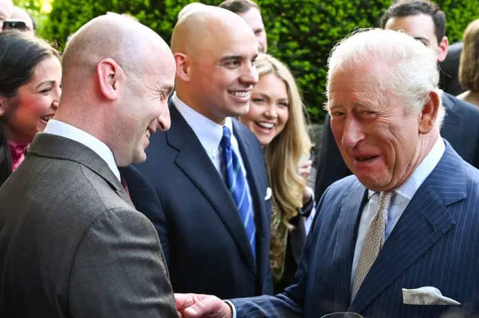 Britain's King Charles III talks with White House Deputy Chief of Staff Stephen Miller  during a garden party at the British Embassy, Monday, April 27, 2026, in Washington. 