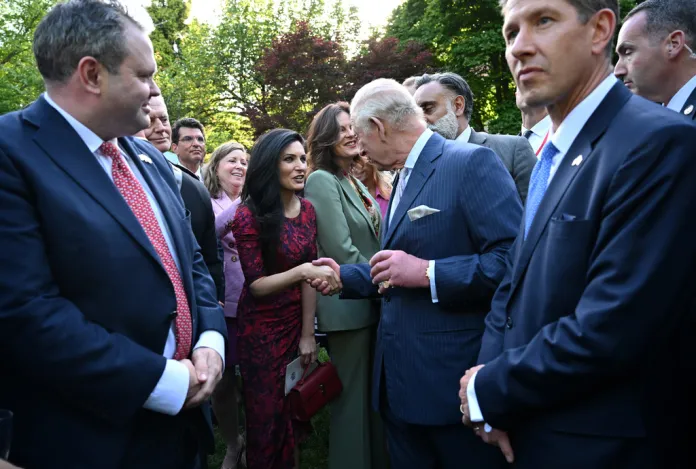 Britain's King Charles III speaks with guests during a garden party at the British Embassy, Monday, April 27, 2026, in Washington. 