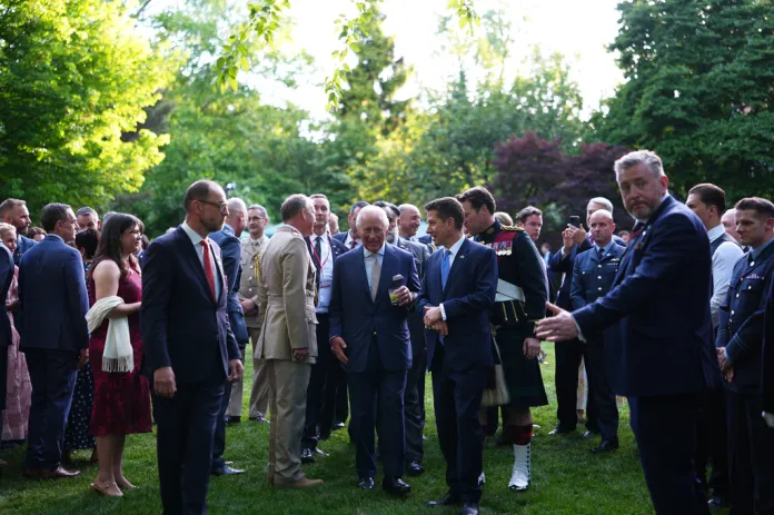Britain's King Charles III, center, and British Ambassador to the U.S. Christian Turner, center right, attend a garden party at the British Embassy, Monday, April 27, 2026, in Washington. 