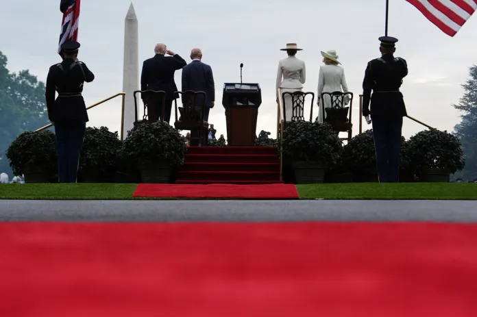President Donald Trump, from left, King Charles III, first lady Melania Trump and Queen Camilla stand on stage during an arrival ceremony on the South Lawn of the White House, Tuesday, April 28, 2026, in Washington.