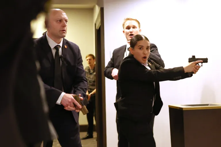FILE - Secret service agents respond during the White House Correspondents Dinner, Saturday, April 25, 2026, in Washington. (AP Photo/Tom Brenner, File)