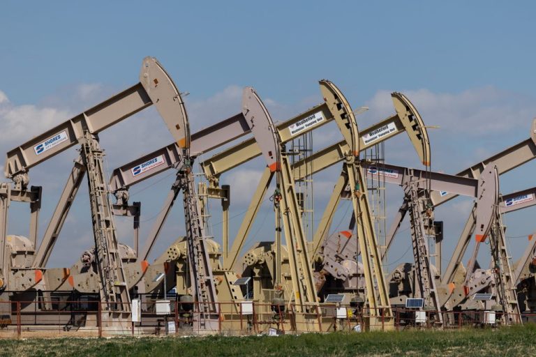 Pumpjacks are seen along Weld County Road.