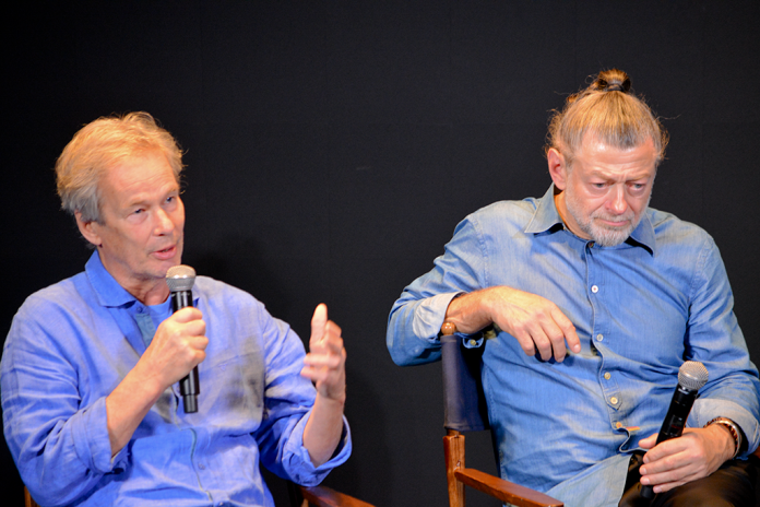 Jonathan Cavendish (L) speaks as his business partner and actor colleague Andy Serkis (R) listens intently during a fireside chat about their latest film, Animal Farm. (Judith Y. Kim/Washington Examiner)