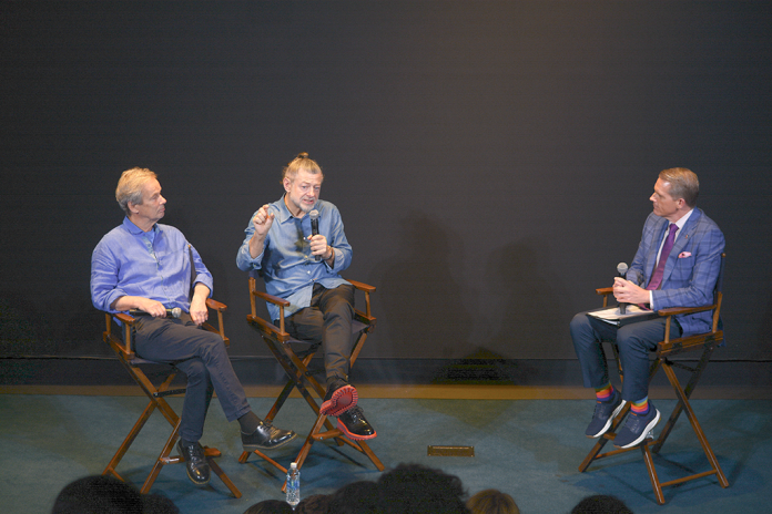 Andy Serkis (C) speaks about his new film, Animal Farm, with business partner Jonathan Cavendish (L) during a fireside chat with Scott Jennings (R). (Judith Y. Kim/Washington Examiner)