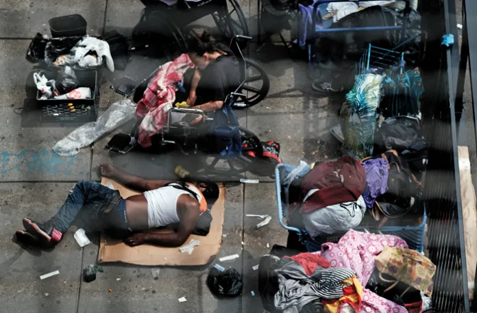 People gather on a street overtaken by drug users in the Kensington neighborhood of Philadelphia, July 19, 2021. (Spencer Platt/Getty)