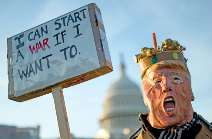 A protester outside the Capitol building as Congress prepares to vote on a war powers resolution, Jan. 9, 2020. (Photo By Bill Clark/CQ-Roll Call, Inc via Getty Images)