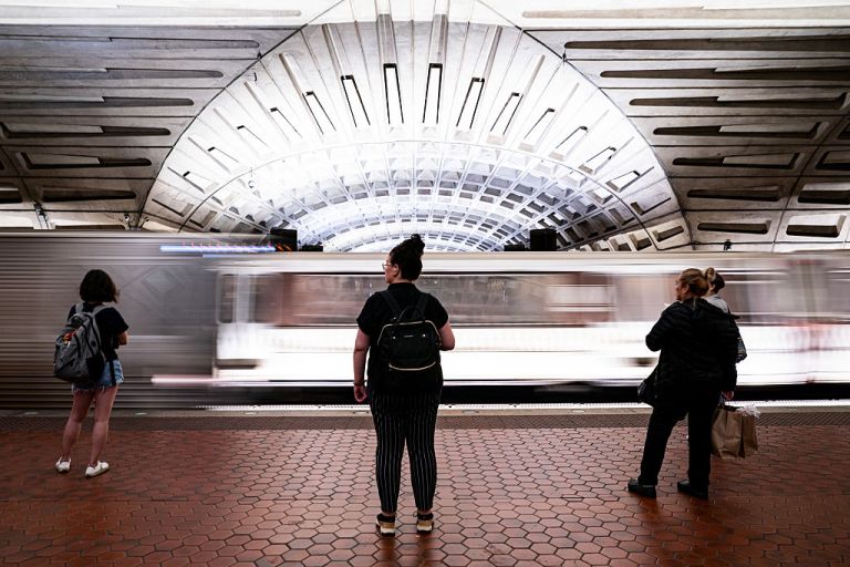 Commuters wait for a Red line Metro train at the Metro Center metro stop in Washington, DC, US, on Friday, May 30, 2025. A House Republican introduced legislation to block federal funding for the Washington Metrorail system unless it is renamed the 
