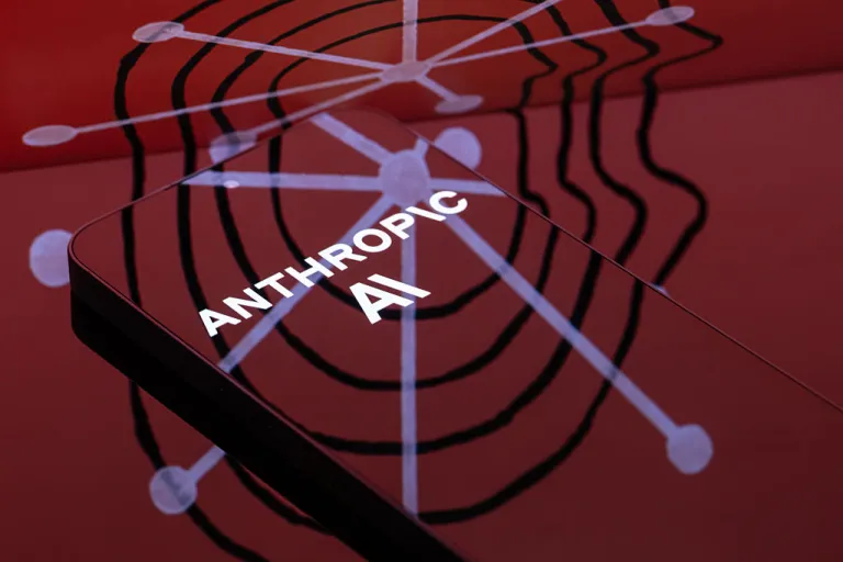 The Anthropic logo is displayed on a smartphone screen in this photo illustration in Brussels, Belgium, on March 31, 2026. A U.S. judge temporarily blocks the Pentagon from blacklisting the AI firm following a dispute over its refusal to allow its technology to be used for surveillance and autonomous weapons. (Photo by Jonathan Raa/NurPhoto via Getty Images)