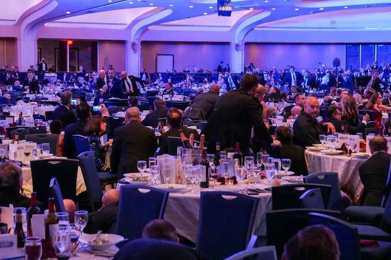 WASHINGTON, DC - APRIL 25: People take cover after an incident at the annual White House Correspondents Association Dinner April 25, 2026 in Washington, DC. According to reports, President Donald Trump, along with other government officials, were evacuated from the Washington Hilton after what sounded like gun fire. According to the FBI’s Washington field office, a 'subject' is in custody. (Photo by Chip Somodevilla/Getty Images)