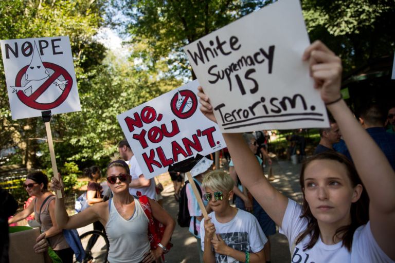 Protestors rally against white supremacy and racism in Columbus Circle on August 13, 2017 in New York City. The rally is organized by a New York City based group called 'Refuse Fascism' following clashes between white supremacists and counter-protestors in Charlottesville, Virginia on Saturday, August 12th. Heather Heyer, 32, was killed in Charlottesville when a car driven by a white supremacist barreled into a crowd of counter-protesters following violence at the 'Unite the Right' rally. (Photo by Drew Angerer/Getty Images)