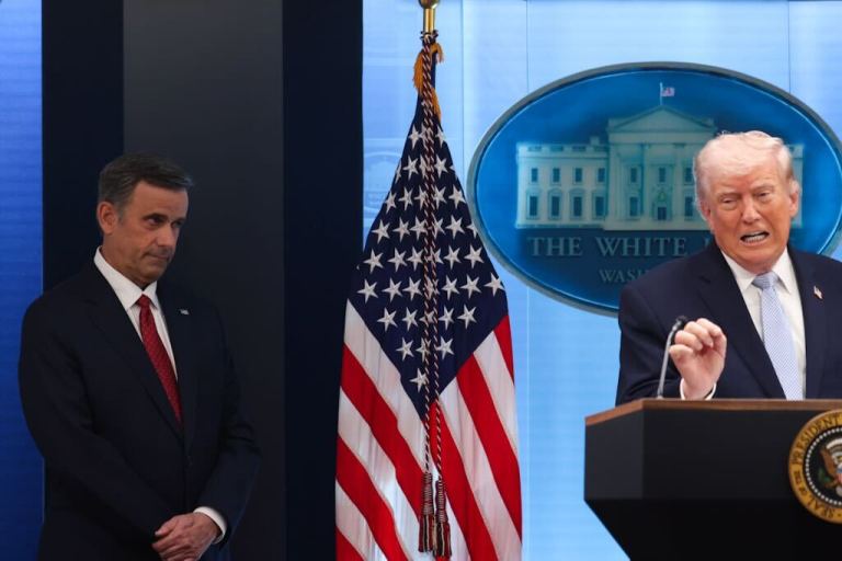 Director of the Central Intelligence Agency John Ratcliffe stands beside President Trump as he speaks to reporters at a press conference at the White House on April 6.