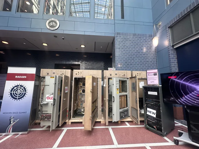 Decades-old radar cabinets are displayed next to newer digital systems at a Department of Transportation exhibit, illustrating the transition from aging air traffic control technology to modern replacements. (Samantha-Jo Roth, Washington Examiner)