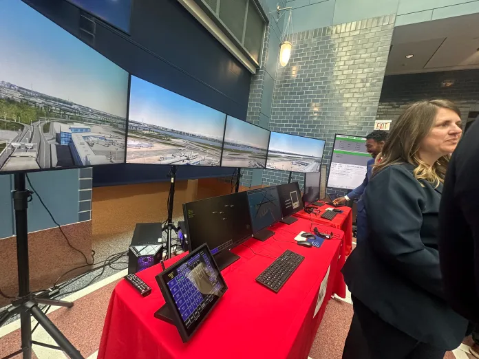 A tower simulation system is demonstrated at a Transportation Department exhibit, showcasing a state-of-the-art training platform that allows air traffic controllers to practice real-world operations, improve performance in complex scenarios, and accelerate certification. Officials said the system will be installed in more than 100 towers nationwide. (Samantha-Jo Roth, Washington Examiner)