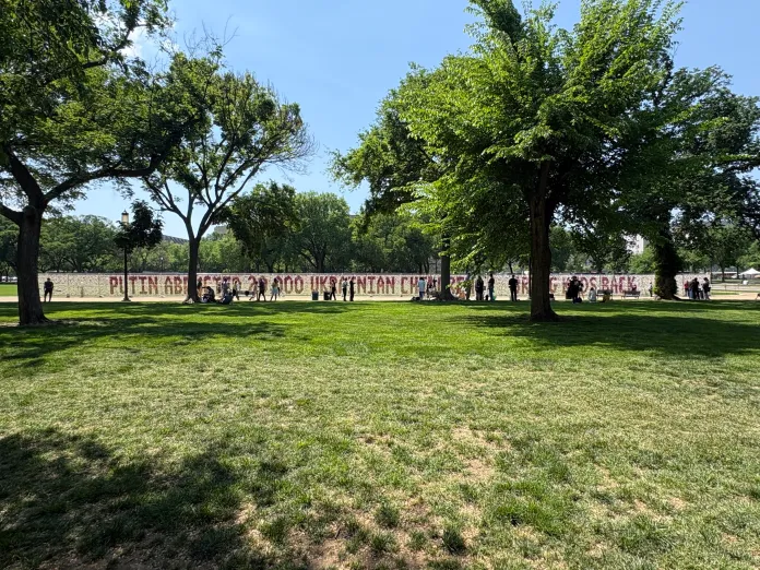 Teddy bear installation with message “PUTIN ABDUCTED 20,000 UKRAINIAN CHILDREN. BRING KIDS BACK.” (Photo by Emily Robertson/Washington Examiner)