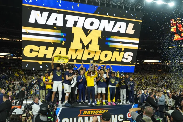 Michigan celebrates after defeating UConn in the NCAA college basketball tournament national championship game at the Final Four, Monday, April 6, 2026, in Indianapolis. (AP Photo/Michael Conroy)
