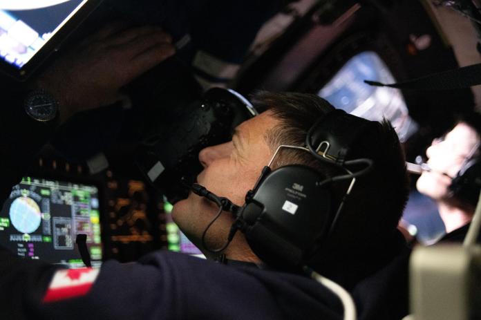 Astronaut and Artemis II Mission Specialist Jeremy Hansen is seen taking images through the Orion spacecraft window. Credit: NASA 