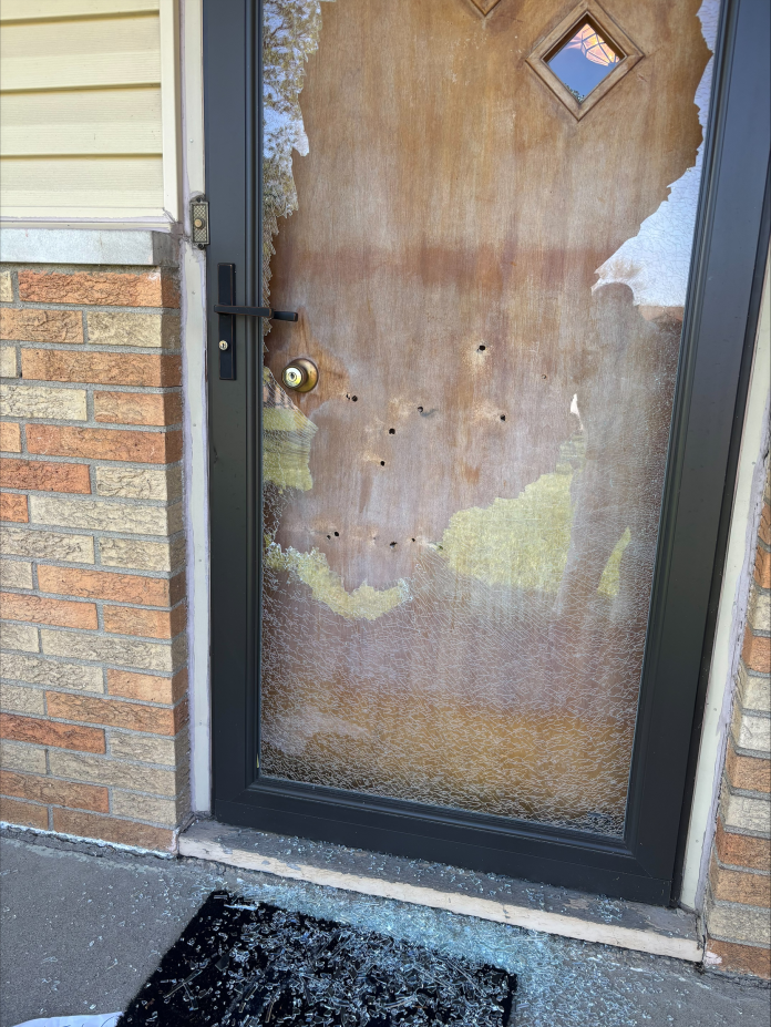 The bullet holes in Indianapolis City-County Councilor Ron Gibson's door.