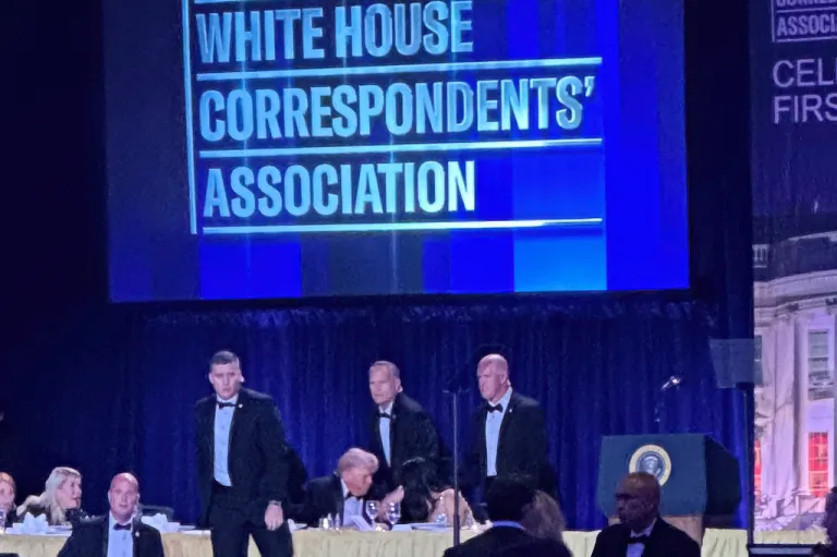 Secret Service agents surround President Donald Trump.