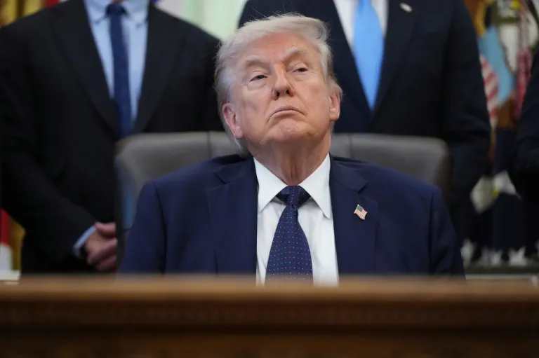 President Donald Trump listens during an event on health care affordability in the Oval Office at the White House.