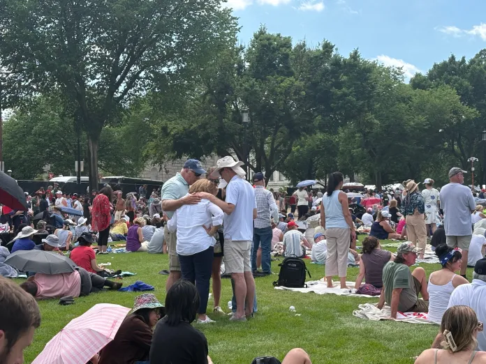 A group of people praying at Rededicate 250 on the National Mall. (Emily Robertson/Washington Examiner)