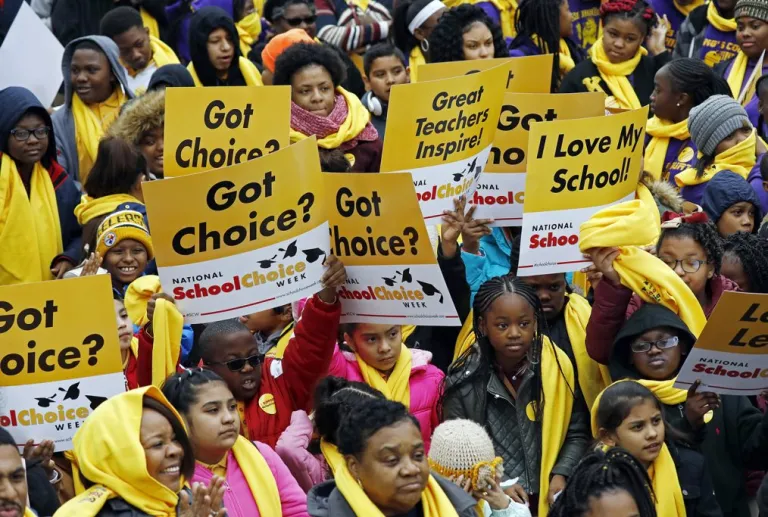 Several hundred students, parents, teachers and elected officials, participate in a school choice rally, part of the National School Choice Week, on the steps of the Capitol in Jackson, Miss., Tuesday, Jan. 22, 2019. The attendees came from throughout the state and gathered to raise public awareness for the different K-12 education options available. (AP Photo/Rogelio V. Solis)