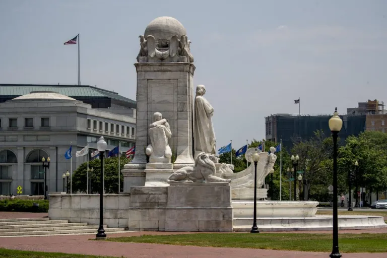 A statue of Christopher Columbus is visible on the Columbus Memorial Fountain in front of Union Station, Monday, July 6, 2020, in Washington. (AP Photo/Andrew Harnik)