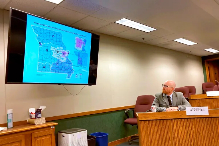 Missouri state Rep. Travis Fitzwater looks at a newly proposed map for dividing up Missouri's congressional districts