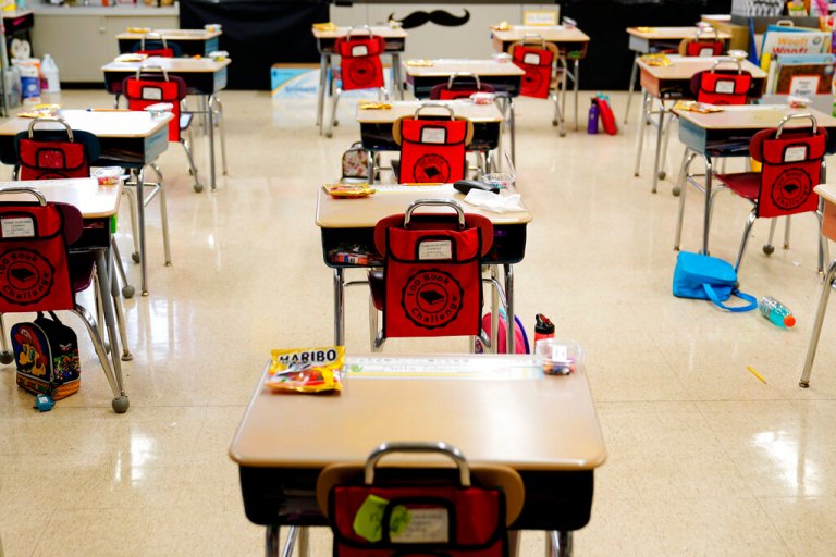 Desks are arranged in a classroom
