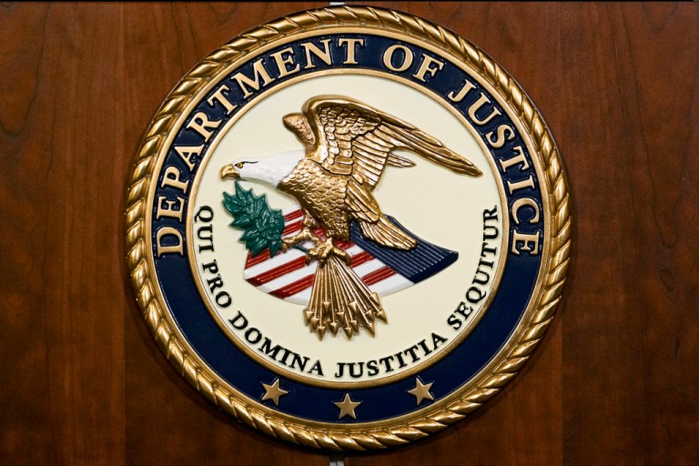 The seal of the Department of Justice.