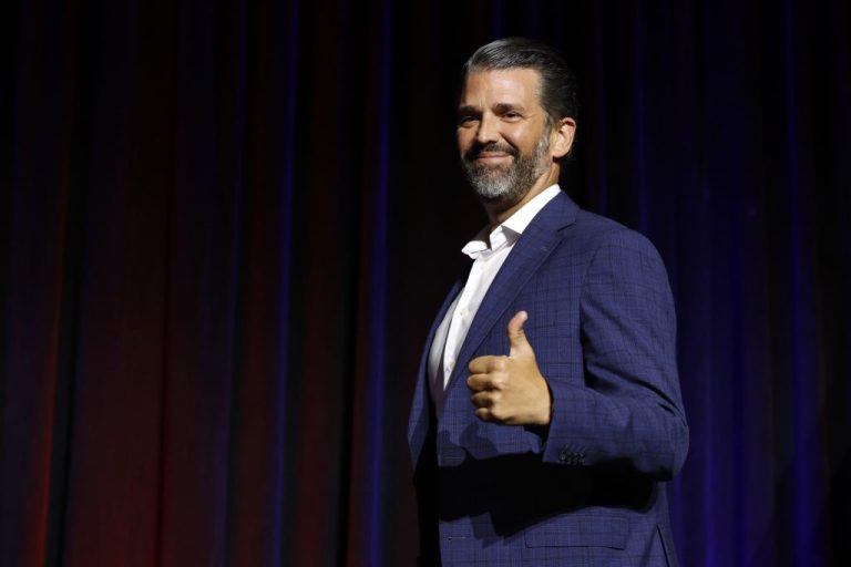 Donald Trump Jr. gives a thumps up.