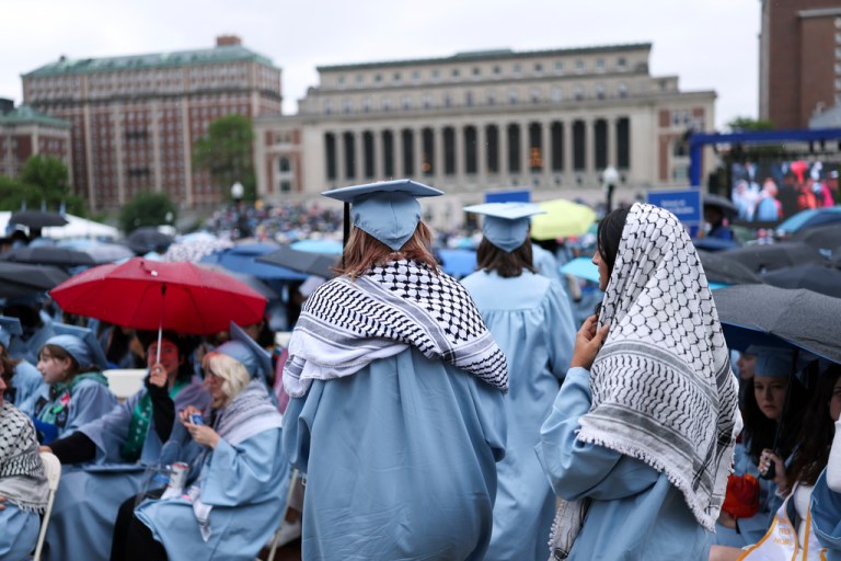 Students wear keffiyeh scarfs.