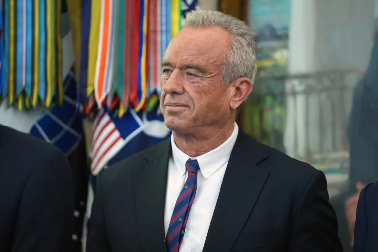 Health and Human Services Secretary Robert F. Kennedy Jr. listens as President Donald Trump speaks.