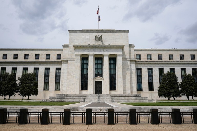 An U.S. flag flies over the Federal Reserve building on May 4, 2021, in Washington.