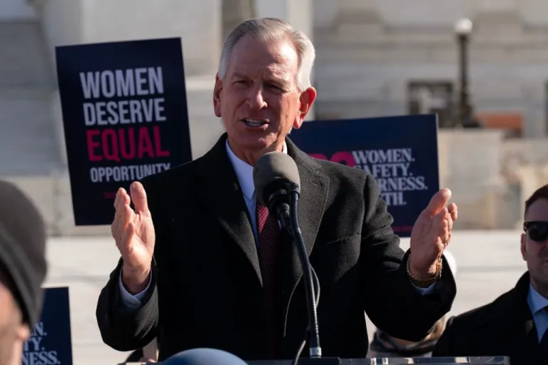 Sen. Tommy Tuberville, R-Ala., speaks to the crowd as protesters gather outside the Supreme Court as it hears arguments over state laws barring transgender girls and women from playing on school athletic teams, Tuesday, Jan. 13, 2026, in Washington. (AP Photo/Jose Luis Magana)