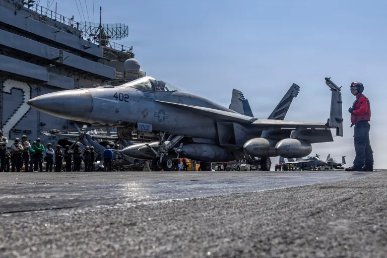This image provided by U.S. Central Command shows a F/A-18E Super Hornet taxiing on the flight deck of the USS Abraham Lincoln (CVN 72) in support of Operation Epic Fury on Monday, March 2, 2026.
