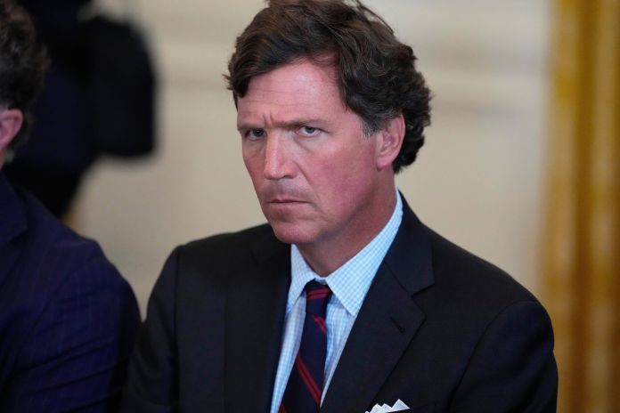 Tucker Carlson attends a meeting with President Donald Trump and oil executives