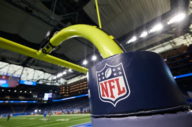 An NFL logo is displayed on a goal post pad during a preseason game between the Buffalo Bills and Detroit Lions.
