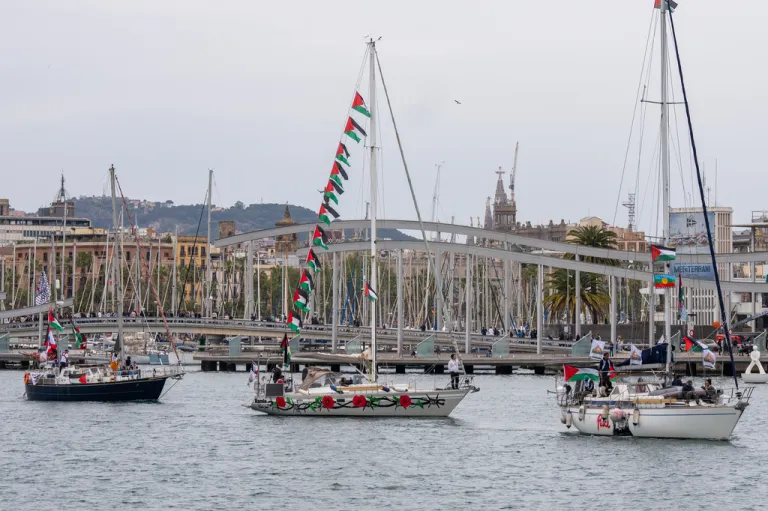 Boats carrying activists and humanitarian aid for Palestinians in Gaza reposition in the port