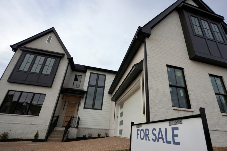 FILE - A for sale sign is posted outside a home, Feb. 10, 2026, in Nashville, Tenn.