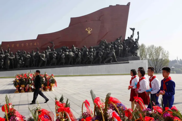 Pyongyang citizens pay respect to the statues of their late leaders.