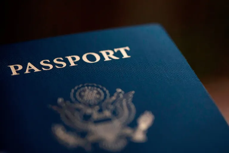 The cover of a U.S. Passport is displayed in Tigard, Ore., Dec. 11, 2021. (AP Photo/Jenny Kane)