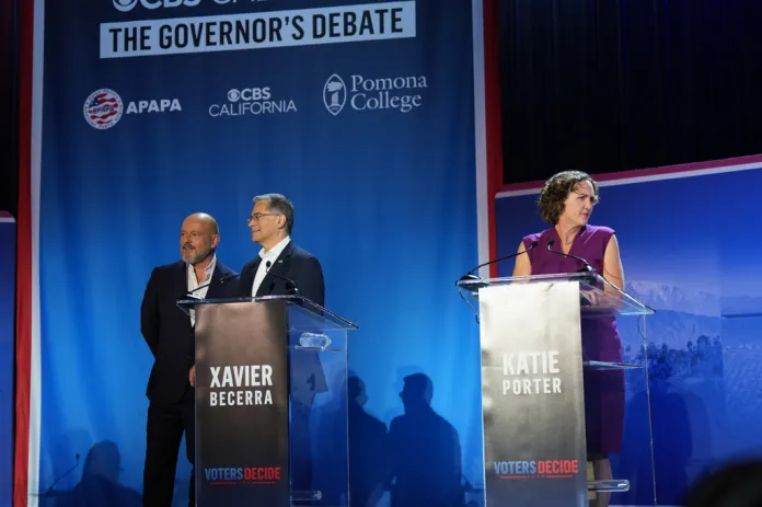 From left, Steve Hilton, Xavier Becerra and Katie Porter wait during a break in a California gubernatorial debate hosted by CBS LA at Pomona College in Claremont, Calif., Tuesday, April 28, 2026.