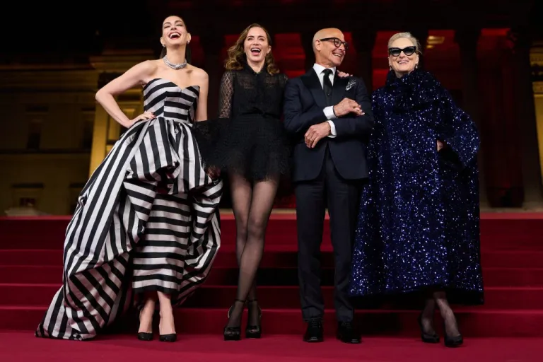 Anne Hathaway, from left, Emily Blunt, Stanley Tucci and Meryl Streep pose for photographers.