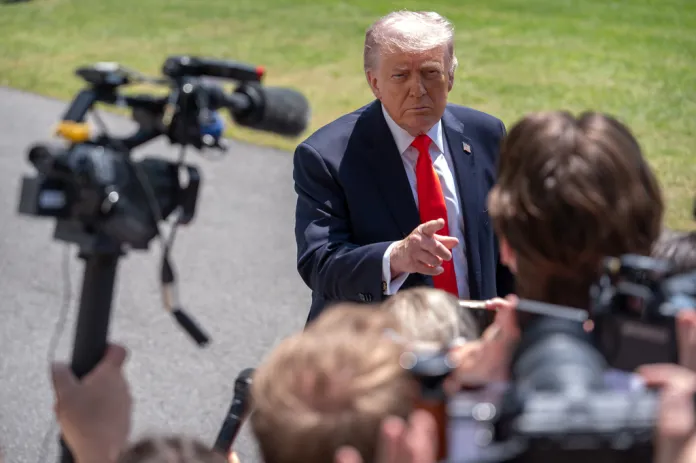 President Donald Trump speaks with reporters as he prepares to board Marine One on the South Lawn of the White House, Friday, May 1, 2026, in Washington.