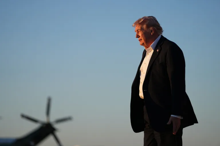 President Donald Trump turns to board Marine One after arriving on Air Force One at Joint Base Andrews.