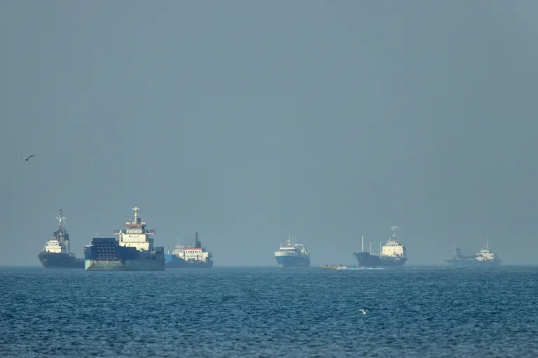 Ships wait in the Strait of Hormuz