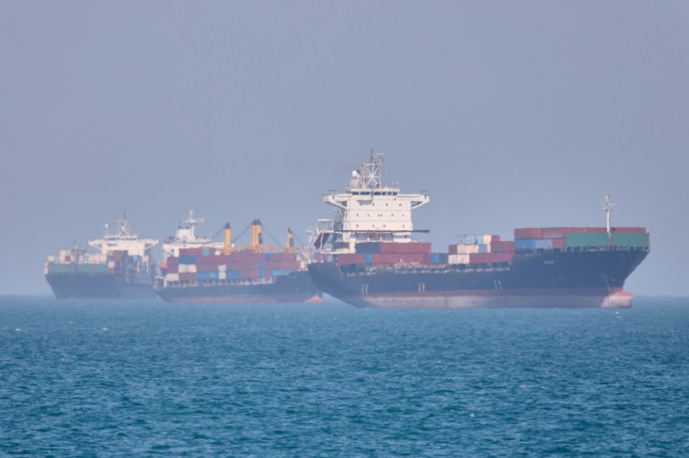 Container ships sit at anchor in the Strait of Hormuz off Bandar Abbas, Iran, Saturday, May 2, 2026.(Amirhosein Khorgooi/ISNA via AP)
