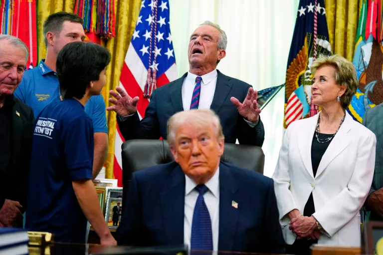 Health and Human Services Secretary Robert F. Kennedy Jr. speaks as Education Secretary Linda McMahon, right, and President Donald Trump listen before the signing of a proclamation in the Oval Office at the White House, Tuesday, May 5, 2026, in Washington.